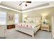 Bright main bedroom featuring a trey ceiling, carpeted floor, and white furniture at 319 Corrigan Trce, Peachtree City, GA 30269