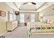 Bright main bedroom featuring a trey ceiling, carpeted floor, and white furniture at 319 Corrigan Trce, Peachtree City, GA 30269