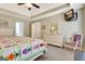 Bright main bedroom featuring a trey ceiling, carpeted floor, and white furniture at 319 Corrigan Trce, Peachtree City, GA 30269