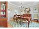 Elegant dining room with a chandelier, a wooden table, stylish chairs, with views to the kitchen and stylish decor at 319 Corrigan Trce, Peachtree City, GA 30269