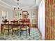 Elegant dining room with a chandelier, a wooden table, and stylish chairs, ideal for gatherings at 319 Corrigan Trce, Peachtree City, GA 30269