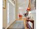 Elegant foyer with hardwood floors, area rug, and views into a music room at 319 Corrigan Trce, Peachtree City, GA 30269