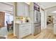 Updated kitchen with stainless steel refrigerator, granite countertop, and convenient storage for coffee and mugs at 319 Corrigan Trce, Peachtree City, GA 30269