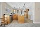 Eat-in kitchen features stainless appliances, bright white marble countertops, and wooden cabinets at 319 Corrigan Trce, Peachtree City, GA 30269