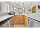 Kitchen features stainless appliances, white marble countertops, and light wooden cabinets at 319 Corrigan Trce, Peachtree City, GA 30269