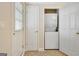 Functional laundry room with tiled flooring and stacked washer and dryer units at 319 Corrigan Trce, Peachtree City, GA 30269