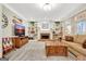 Inviting living room with a cozy fireplace, custom built-ins, and plush carpet at 319 Corrigan Trce, Peachtree City, GA 30269