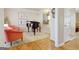 Music room featuring a grand piano, cozy seating, and stylish decor at 319 Corrigan Trce, Peachtree City, GA 30269