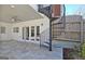 Covered patio with spiral staircase and exterior access doors at 319 Corrigan Trce, Peachtree City, GA 30269