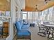 Inviting screened porch with comfortable blue seating, ceiling fans, and natural wood ceiling at 319 Corrigan Trce, Peachtree City, GA 30269