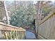 Stone steps leading down a hill with green trees and green plants at 319 Corrigan Trce, Peachtree City, GA 30269