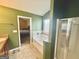 Spacious bathroom with soaking tub, separate shower, and view into the bedroom from the doorway at 9108 Alden Dr, Locust Grove, GA 30248