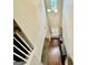Bright entryway hallway featuring hardwood floors and natural light at 9108 Alden Dr, Locust Grove, GA 30248