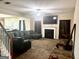 Cozy living room featuring a fireplace, plush seating, and a mounted television at 9108 Alden Dr, Locust Grove, GA 30248