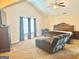 Spacious main bedroom with vaulted ceilings, a sitting area, and plush carpeting at 9108 Alden Dr, Locust Grove, GA 30248