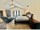 Cozy main bedroom with a sitting area, ceiling fan, and plush carpeting at 9108 Alden Dr, Locust Grove, GA 30248