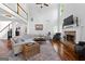 Bright living room boasts hardwood floors, fireplace, and natural light at 226 Le Paradis Blvd, Sharpsburg, GA 30277