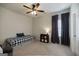 Cozy bedroom with a twin bed, side table, and dark curtains for privacy at 7435 Ansley Park Way, Cumming, GA 30028