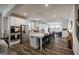Kitchen features a large island with pendant lighting, stainless steel appliances, and hardwood floors at 7435 Ansley Park Way, Cumming, GA 30028