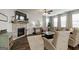 Cozy living room with a stone fireplace, neutral decor, and plenty of natural light at 7435 Ansley Park Way, Cumming, GA 30028