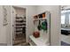 Mudroom with built-in storage and access to a pantry at 7435 Ansley Park Way, Cumming, GA 30028
