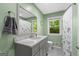 Updated bathroom featuring a vanity with marble counters, and a window at 1256 Horsley Mill Rd, Carrollton, GA 30116