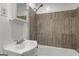 Updated bathroom with tile shower, bathtub, and sink with storage at 1256 Horsley Mill Rd, Carrollton, GA 30116