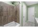 Neutral bathroom with tile shower, bathtub, and updated fixtures at 1256 Horsley Mill Rd, Carrollton, GA 30116