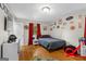 Bedroom with hardwood floors, fun decor and a large window at 1256 Horsley Mill Rd, Carrollton, GA 30116