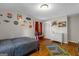 Bedroom showcasing hardwood floors and a closet with sliding doors at 1256 Horsley Mill Rd, Carrollton, GA 30116