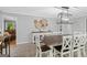 Dining area open to the kitchen features a large wooden table, cabinets, and decor at 1256 Horsley Mill Rd, Carrollton, GA 30116