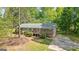 Inviting single-story house with a cozy porch, a well-maintained yard, and a convenient driveway at 1256 Horsley Mill Rd, Carrollton, GA 30116