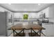 Bright kitchen featuring white cabinets, stainless appliances, granite counters and a spacious center island at 1256 Horsley Mill Rd, Carrollton, GA 30116