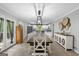 Bright kitchen flows into the dining area with large table and access to a deck at 1256 Horsley Mill Rd, Carrollton, GA 30116