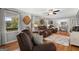 Cozy living room with hardwood floors, comfortable seating, and windows that bring in natural light and warmth at 1256 Horsley Mill Rd, Carrollton, GA 30116