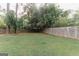 View of the property's expansive fenced-in backyard, offering privacy and room for outdoor activities at 15 Pine Run Rd, Carrollton, GA 30116