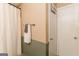 Neutral bathroom with white storage, gray towels, and updated shower curtain for a refreshing feel at 15 Pine Run Rd, Carrollton, GA 30116