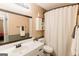 A neutral bathroom with white cabinets, a modern shower curtain, and a framed mirror, for a clean aesthetic at 15 Pine Run Rd, Carrollton, GA 30116
