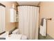 A clean bathroom with white cabinets, a shower curtain, and a towel rack for easy access at 15 Pine Run Rd, Carrollton, GA 30116