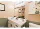 Classic bathroom with white sink, ample storage, and earth-tone paint; a soothing color palette at 15 Pine Run Rd, Carrollton, GA 30116