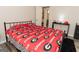 Cozy bedroom with a sports team theme, dark floors and natural light. Ideal for a dedicated fan at 15 Pine Run Rd, Carrollton, GA 30116