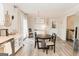 Bright dining area with neutral paint, and natural light from the patio doors, perfect for hosting and entertaining at 15 Pine Run Rd, Carrollton, GA 30116