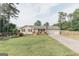 Charming single-story home with a well-maintained lawn, a front porch, and a two-car garage at 15 Pine Run Rd, Carrollton, GA 30116