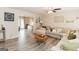 Inviting living room with hardwood floors, a ceiling fan, and a comfortable sectional sofa at 15 Pine Run Rd, Carrollton, GA 30116