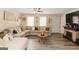 Bright living room with a fireplace and a large sectional sofa at 15 Pine Run Rd, Carrollton, GA 30116