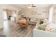 Comfortable living room with a large sectional sofa, ceiling fan, and hardwood floors at 15 Pine Run Rd, Carrollton, GA 30116
