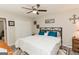 The main bedroom features a decorative headboard and a ceiling fan at 15 Pine Run Rd, Carrollton, GA 30116