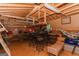 Inside the shed is an open space with pegboard walls, work tables, and overhead storage racks at 15 Pine Run Rd, Carrollton, GA 30116