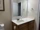 Bathroom featuring a stylish sink and vanity area with marble countertop and wooden cabinets at 30 Scouts Ridge Dr, Covington, GA 30016