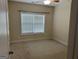 Simple bedroom featuring carpet, a large window with blinds, and neutral paint at 30 Scouts Ridge Dr, Covington, GA 30016